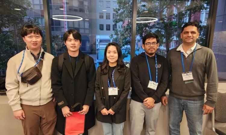  Institute of Electrical and Electronics Engineers (IEEE) International Solid-State Circuits Conference (ISSCC) photo of Georgia Tech faculty members with students.